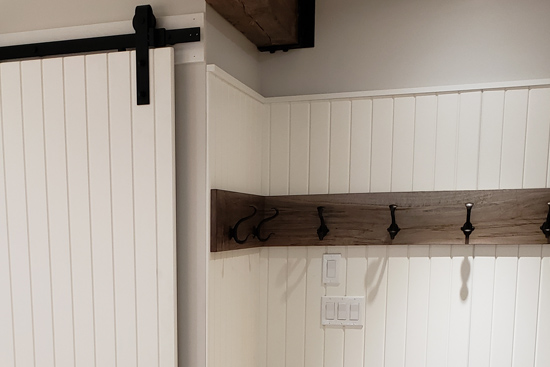 Custom bead board entry area with sliding door panels.