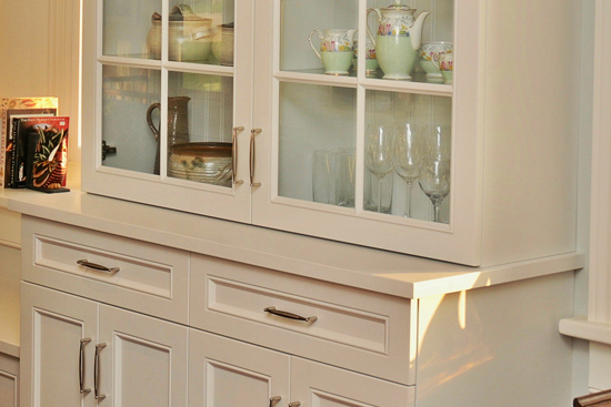 China cabinets with bead-board backs and painted counter tops. Glass shelves. Two-stage crown molding tops