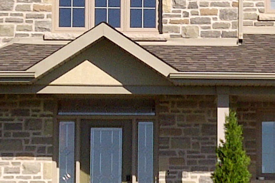 New installation of windows and doors; siding, sofits, eavestrough, aluminium porch posts. Custom curved-top window.
