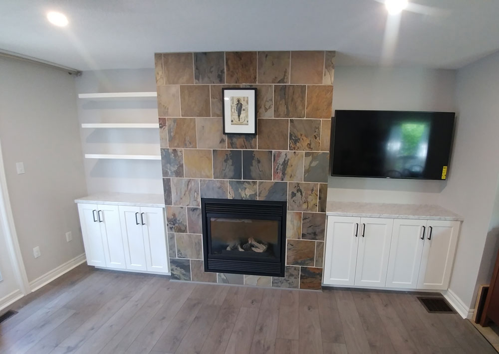 Custom floating shelves with custom Shaker-style door entertainment unit in living room