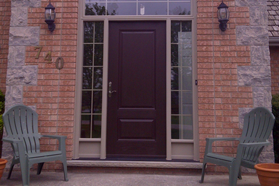 Replacement of large curved-top transom window and flanking sidelights at front door in Fergus