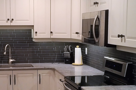 Custom new cabinetry for L-shaped kitchen with upper-angle cabinet and lazy-susan cabinet